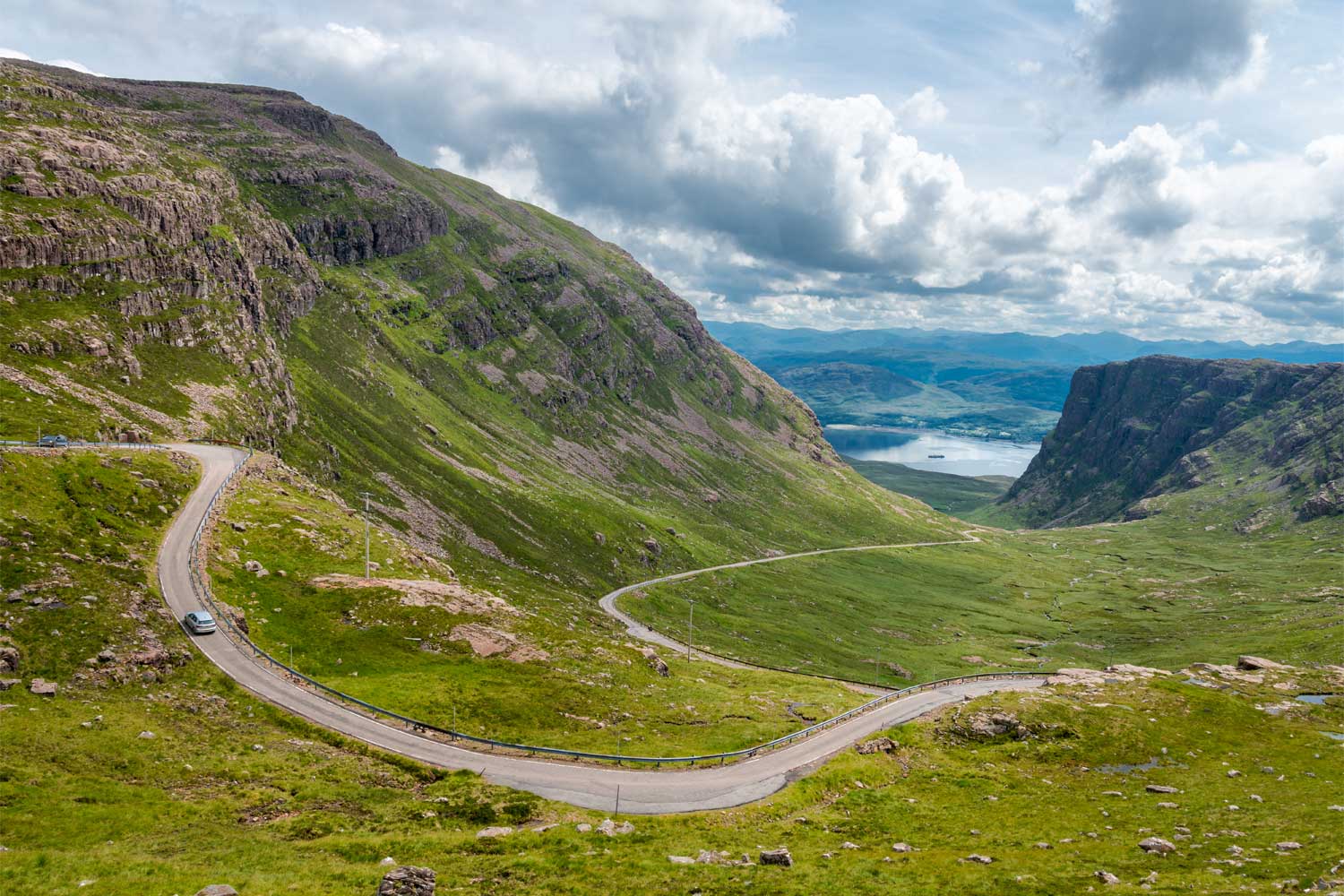 The scenic road to Loch Maree, a key part of the North Coast 500 Vacation Itinerary from Turas Travel.