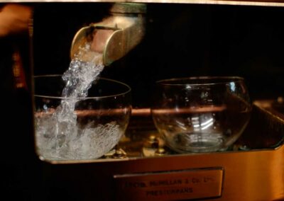 New make spirit flowing through a spirit still. Used to illlustrate the Scottish whisky tours available from Turas Travel.