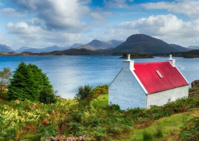 a pretty croft with a red roof