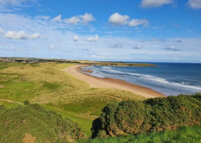 fantastic view of a golf course near a beach