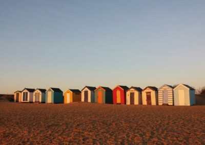 huts on the beach of the english coastline