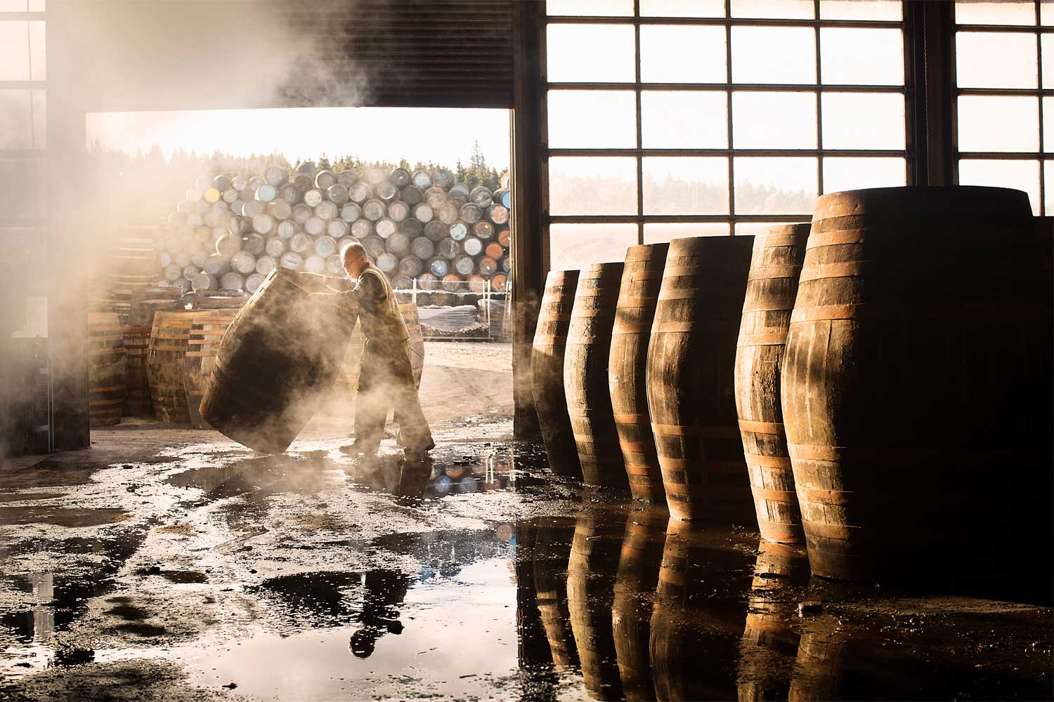A worker rolls a cask at the speyside cooperage, a stopping point on the scottish whisky tour with Turas Travel
